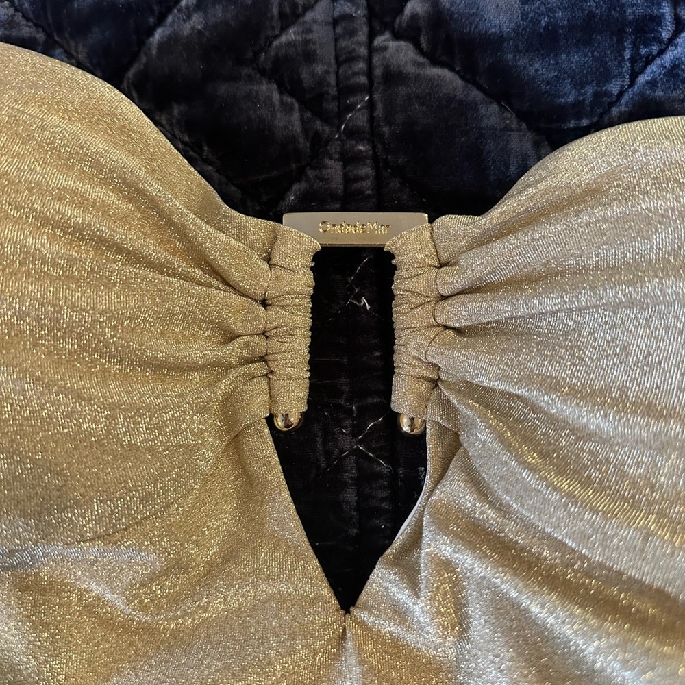 Brand new with tags. Gold bathing suit.